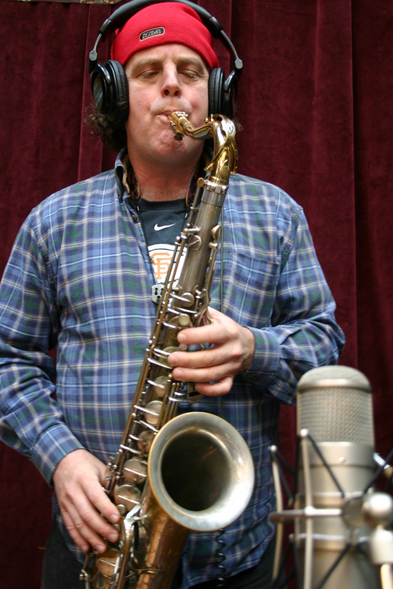 Doug Rowan, of the Wide Hive Players, playing a saxophone. 