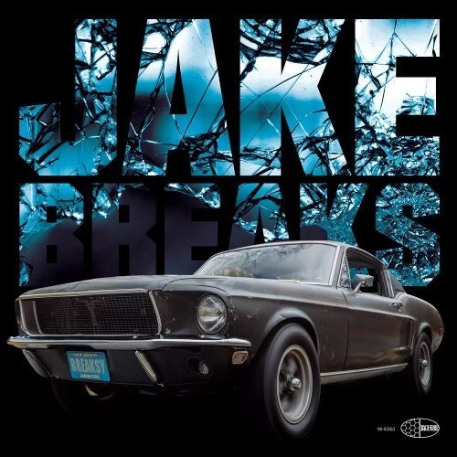 A photo of a classic Ford Mustang with the words "Jake Breaks" behind it.